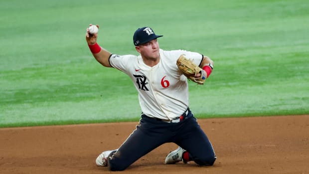 Jun 16, 2023; Arlington, Texas, USA; Texas Rangers third baseman Josh Jung (6) dives for the ball and makes a put out during the fourth inning against the Toronto Blue Jays at Globe Life Field. Mandatory Credit: Kevin Jairaj-USA TODAY Sports